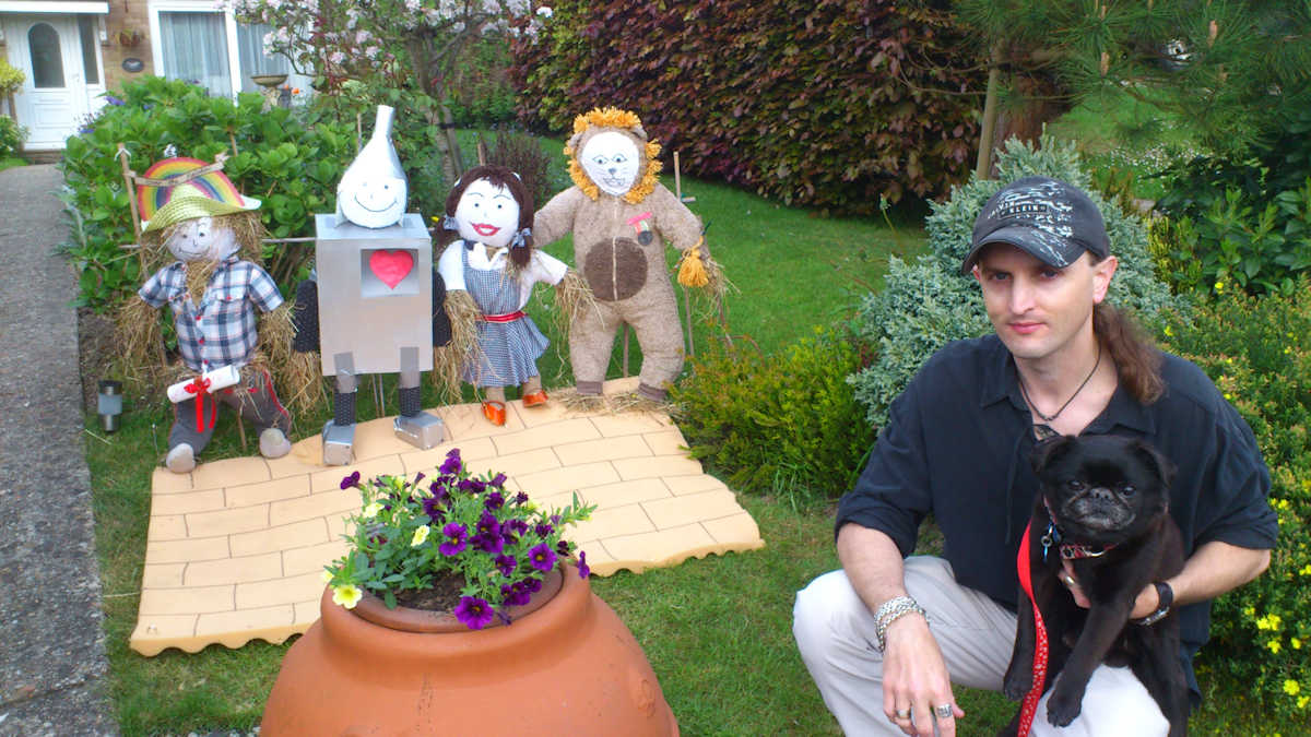 C.J. Carter-Stephenson with Wizard of Oz themed scarecrows.