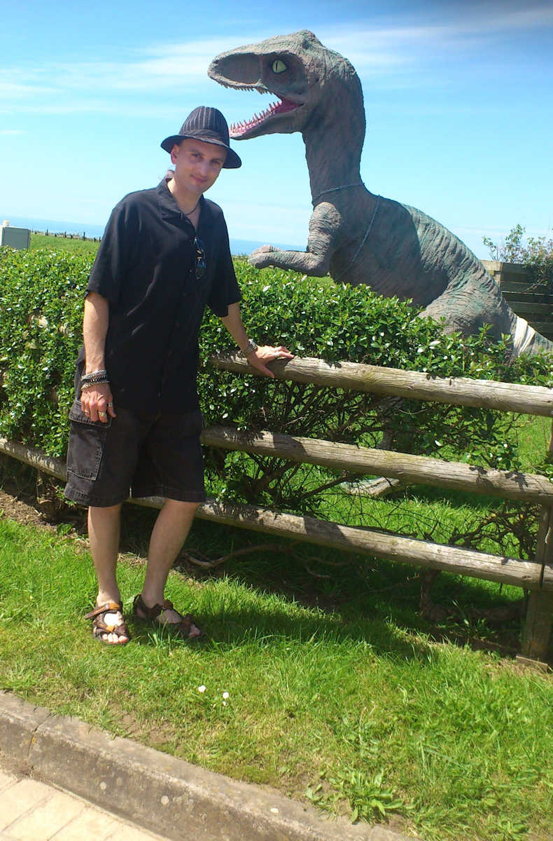 C.J. Carter-Stephenson with model dinosaur on Isle of Wight.