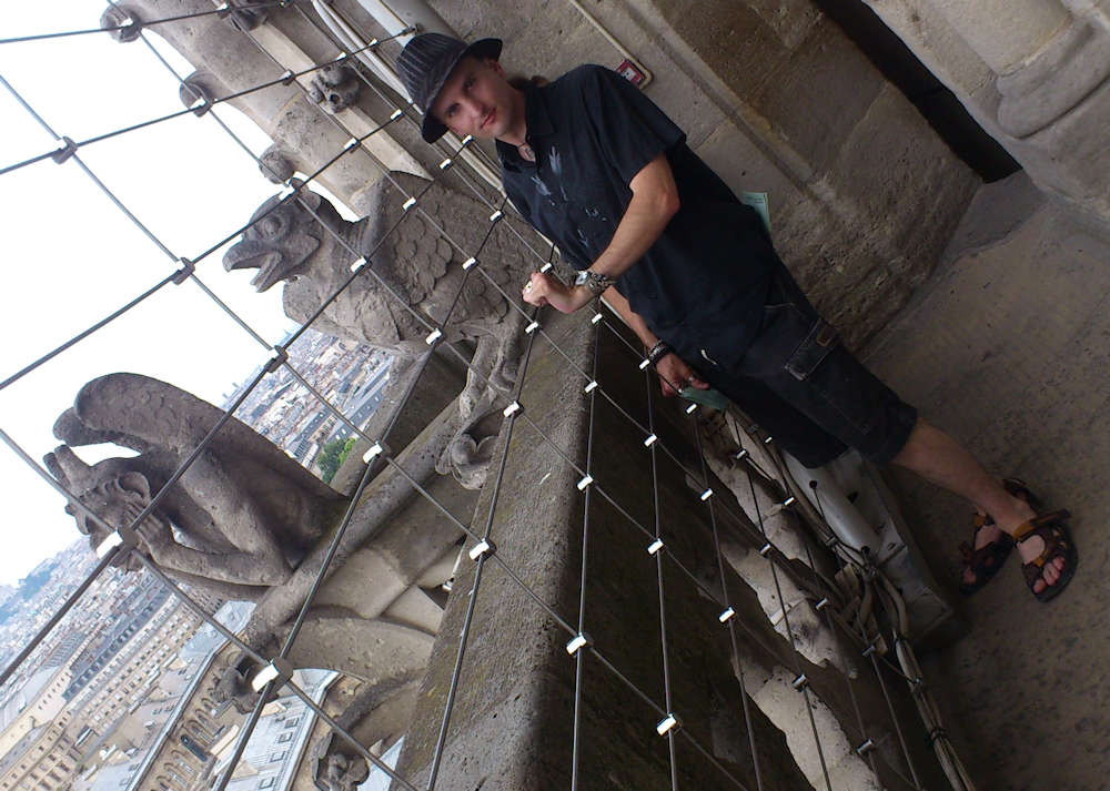 C.J. Carter-Stephenson with gargoyles at Notre Dame Cathedral.