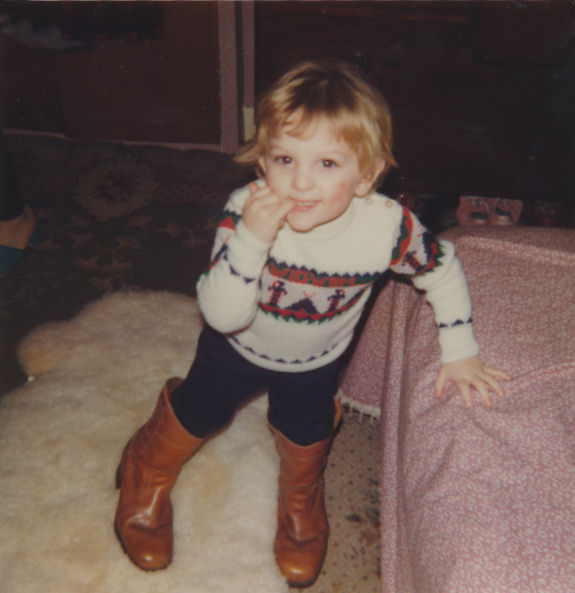 C.J. Carter-Stephenson as toddler in big boots.