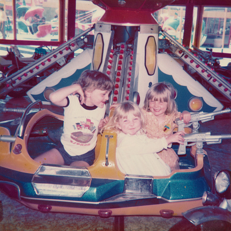 C.J. Carter-Stephenson on spaceship ride with sister and cousin.